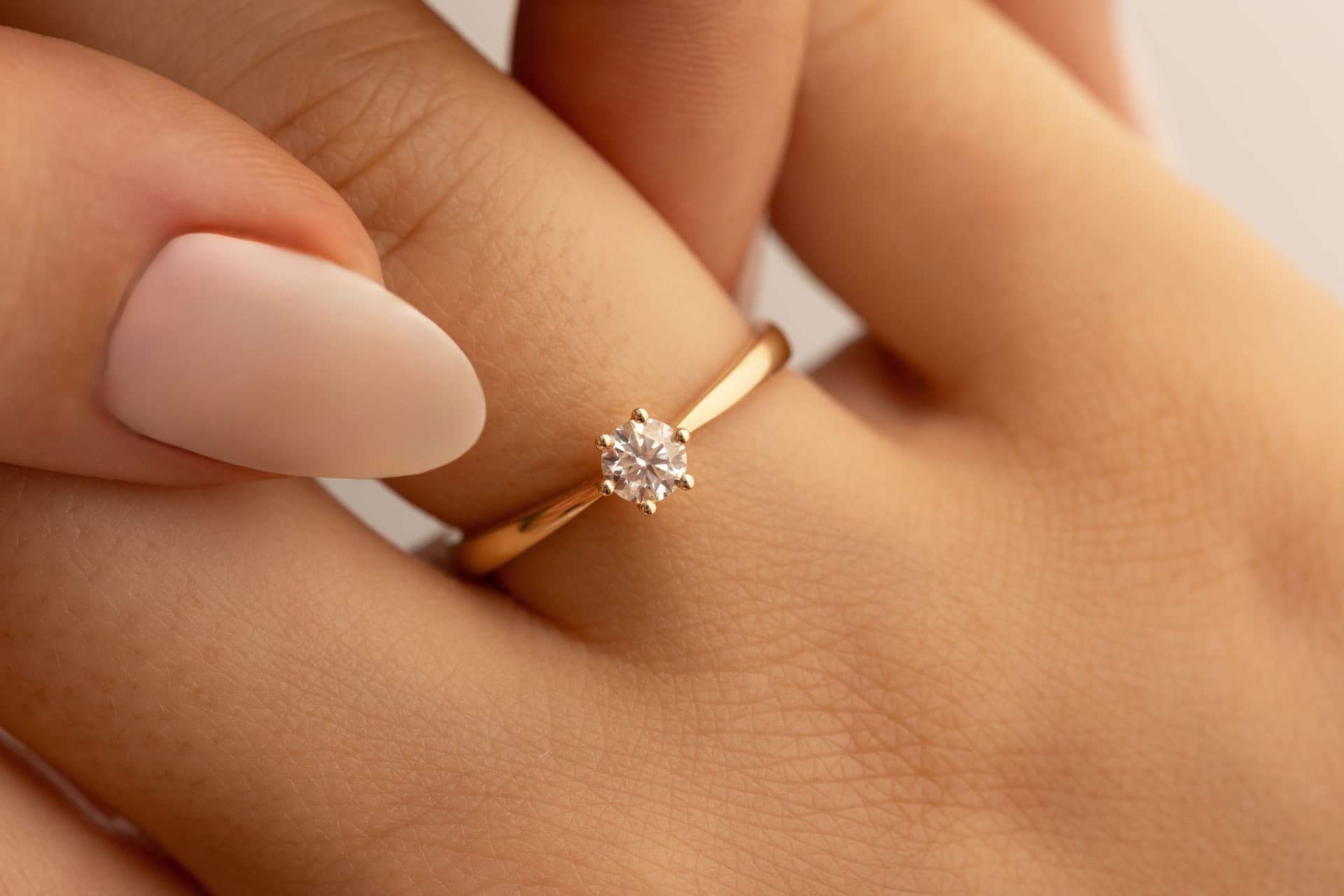Memorial diamond ring worn on a hand