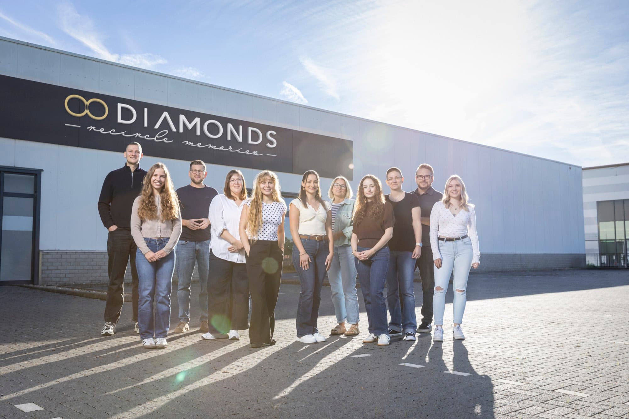 The 8 Diamonds team in front of the company building